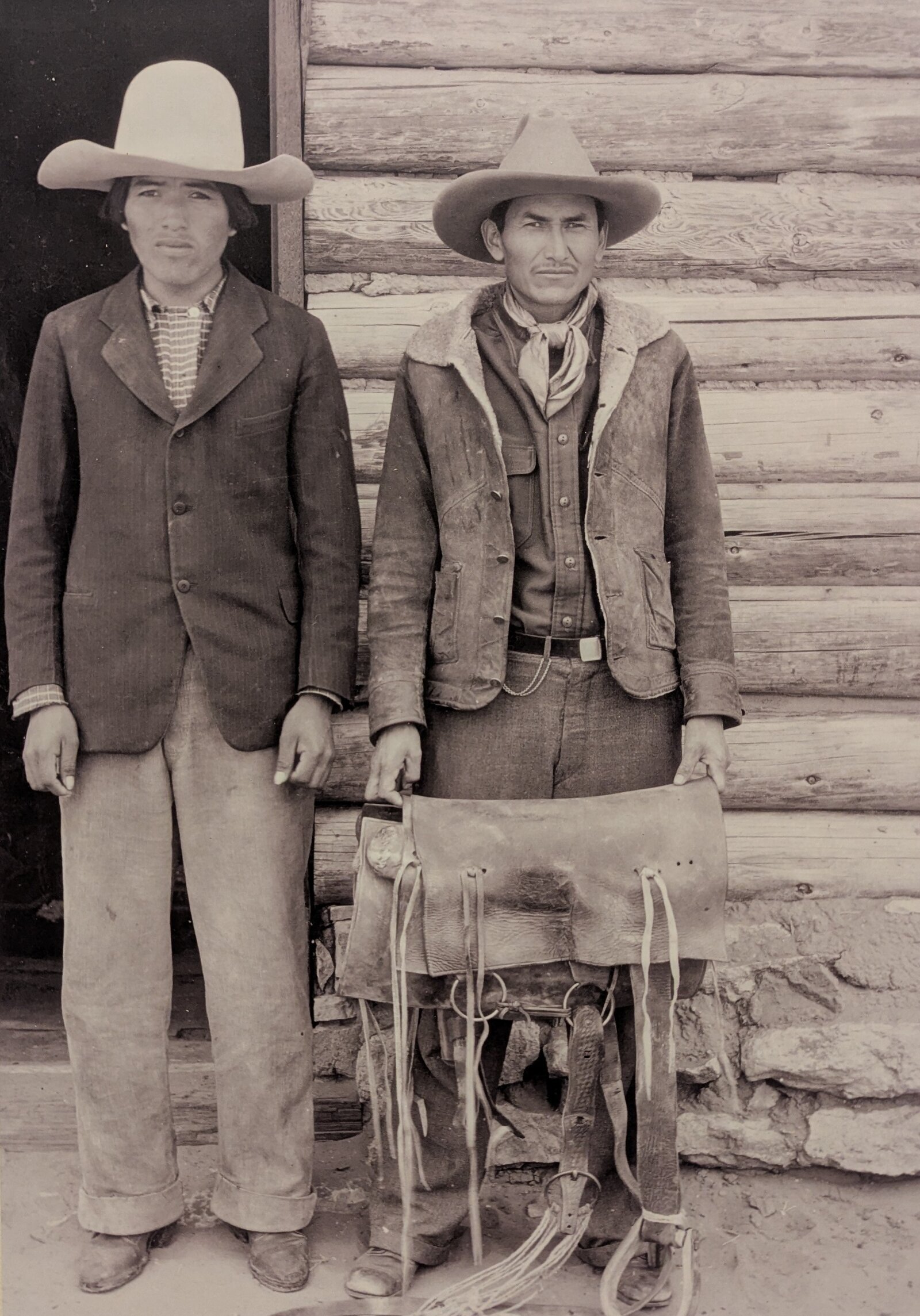 A portrait of Big Belly's nephew and Dannie Bia with old-style saddle.